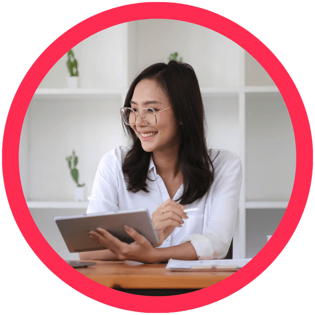 Person smiling while using a tablet